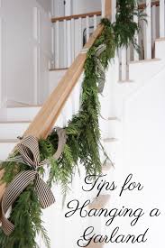 Use these super handy village lighting bannister protecting garland ties for fabulous results, you may want to keep that garland up all year it will look so wonderful and go up so easily (but don't. Tips For Hanging Garland Pink Peppermint Design