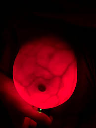 Got bored. Used strong flashlight to try to “see” my breast implant.  Instead, looks like an alien planet. Was not disappointed. Warning: boob.  NSFW : r/pics