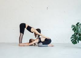 This advanced pose improves lower body strength for the base person, while opening up. 6 Partner Yoga Moves Anyone Can Do Om The City