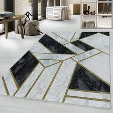 geometric black white gold rug