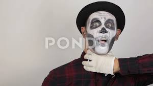 horrible man in clown makeup is chokin