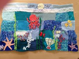 A fidget, fiddle, or busy quilt or sensory activity blanket is a small lap quilt, mat or blanket that provides sensory and tactile stimulation for the restless or fidgety hands of someone with. Under The Sea Handmade Crocheted Sensory Weighted Blanket Fidget Quilt Fidget Blankets Sensory Blanket
