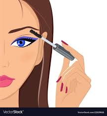 attractive woman applying mascara