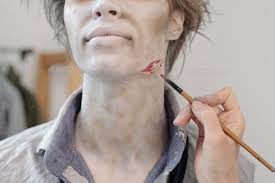 paintbrush making zombie visage