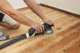 sheets of sandpaper to sand a floor