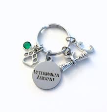 It features the veterinary symbol and a paw print. Graduation Gift For Veterinarian Assistant Keychain Vet Etsy Gifts For Veterinarians Vet Tech Gifts Veterinarian Assistant
