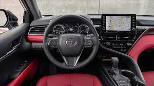 Toyota may make a profit on the delivery, processing and handling fee.) excludes taxes, license, title and available or regionally required equipment. 2021 Toyota Camry Xse White Red Interior