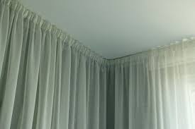 how to hang curtain rod on angled wall