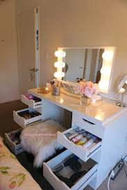vanity with drawers open blushing in
