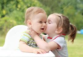 children kissing stock photo by