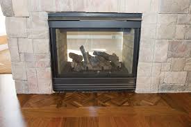 fireplace with wood flooring