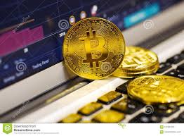 Gold Bitcoin On The Laptop Keyboard On The Background Of The
