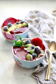beautiful acai bowls with granola and berries