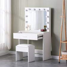 vanity table with large lighted mirror