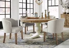 Dining chairs don't just need to look good, they need to be comfortable enough so you will want to linger around the table well past dessert. Grindleburg Linen 5 Pc Round Upholstered Dining Set Louisville Overstock Warehouse