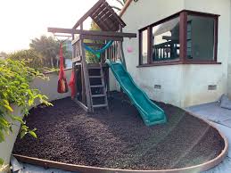 install rubber mulch for playgrounds