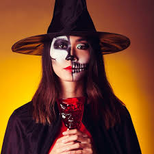free photo young witch holding cup