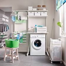 Stackable washer and dryer, sink, counter space, upper and lower cabinets, drop down ironing board and hanging rod. 7 Things Every Organised Functional Laundry Needs