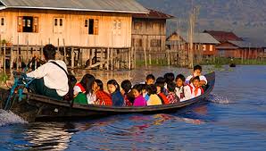 Children going to school in boat
