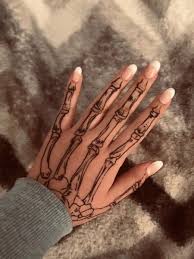 20 cool skeleton hand tattoo ideas