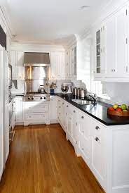 white kitchen cabinets with black