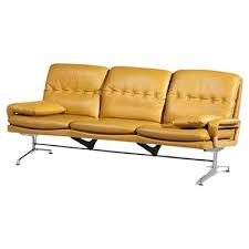 yellow leather sofa in the style of