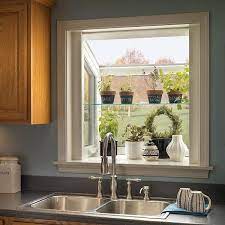 When i shared our 100 year old kitchen, i gave you a glimpse of my greenhouse window. Garden Window Installation Greenhouse Window Bent Glass Window