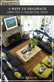 Dark gray walls are a dramatic backdrop to the otherwise warm colored room, better homes and love the grey and camel. 4 Ways To Decorate Around Your Charcoal Sofa Maria Killam
