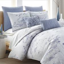 white comforter with blue flowers