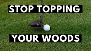 how to stop topping the golf ball