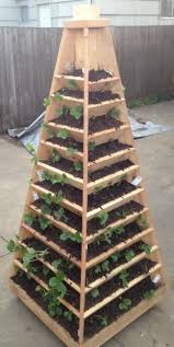 Diy vertical strawberry pallet planter. How To Build A Vertical Garden Pyramid Tower For Your Next Diy Outdoor Project