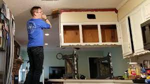 Removing upper cabinet to further open up den & kitchen. - YouTube