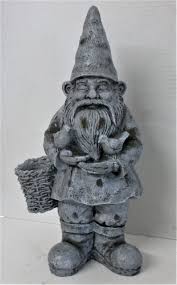 gnome standing with birds and basket