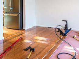 can you install hardwood over carpet