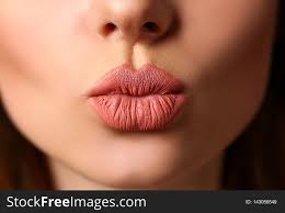 beautiful female lips making kiss