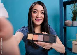 pov of asian influencer holding makeup