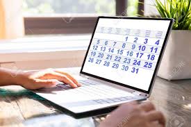 Close-up Of A Business Person Looking At Calendar On Laptop Computer Stock Photo, Picture And Royalty Free Image. Image 128981015.