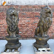 Pair Of Red Marble Sitting Lion Statues