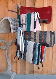 A Wall Mounted Saddle Pad Rack Will