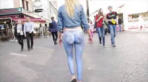 Girl Wearing Just A Thong And Booty Painted Jeans Walks Down Busy.