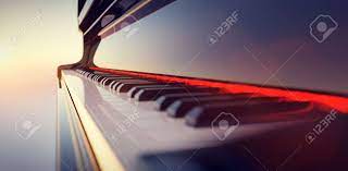 Grand Piano Keyboard On Sunset Sky Background. Music And Entertainment  Фотография, картинки, изображения и сток-фотография без роялти. Image  173609138
