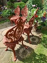 Four Cast Iron Garden Chairs