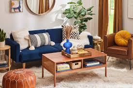 decorating around a navy blue sofa