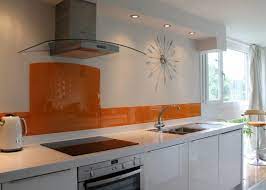 Zesty orange subway tiles on backsplash pop against the white cabinet and countertop. 17 Amazing Orange Kitchen Backsplash Ideas To Inspire You