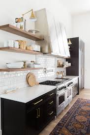 The solution is to create shelves with borders, and one way to do this is to incorporate wall cabinets without doors, or even using cabinets as your shelves entirely. 10 Lovely Kitchens With Open Shelving