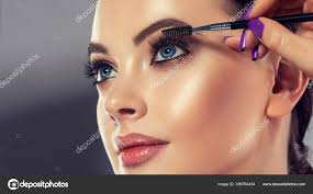 makeup artist applies mascara eyelashes