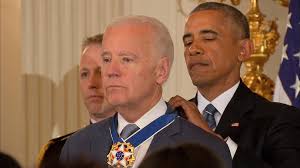 The meme features a pair of photographs of obama, in what appears to be a saudi palace, receiving an elaborate the text says, unconstitutional!!! Joe Biden Gets Emotional As President Obama Surprises Him With Medal Of Freedom