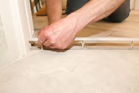 install a transition strip tile to wood