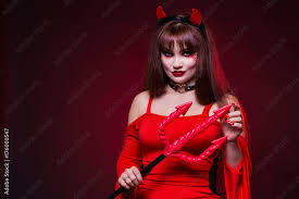 a beautiful woman in a devil costume