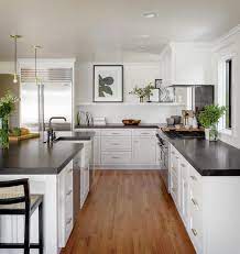 white kitchen cabinets with black